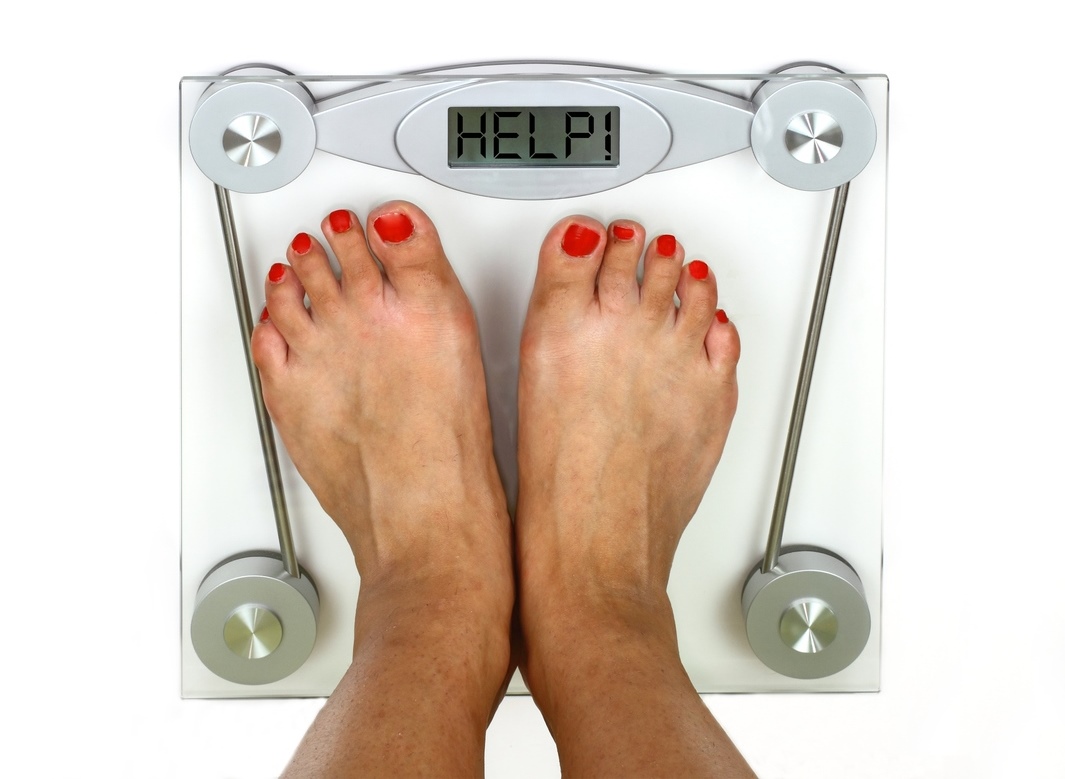 Woman_on_weighing_scales